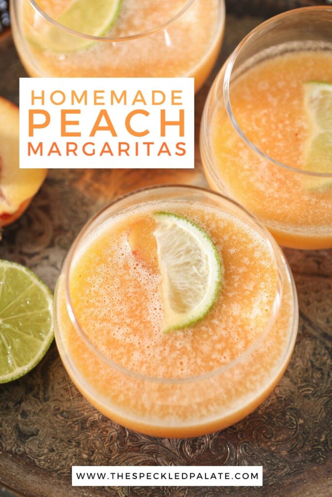 Three orange margaritas on a metal tray with text homemade peach margaritas