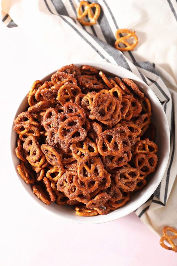 A bowl of Cinnamon Sugar Pretzels on a striped towel