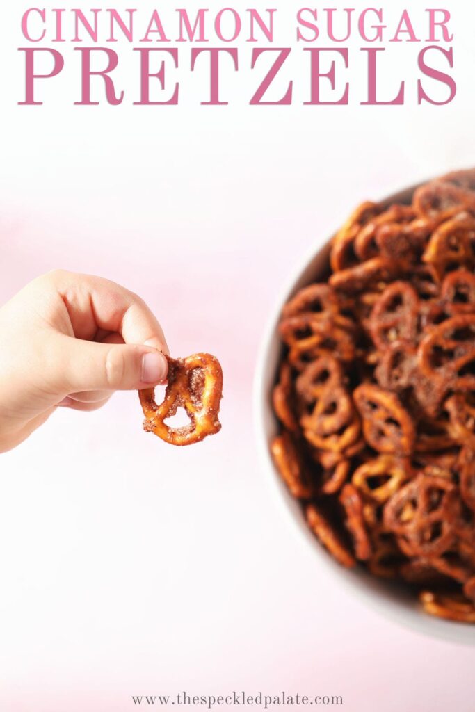 A child holds a pretzel with the text cinnamon sugar pretzels