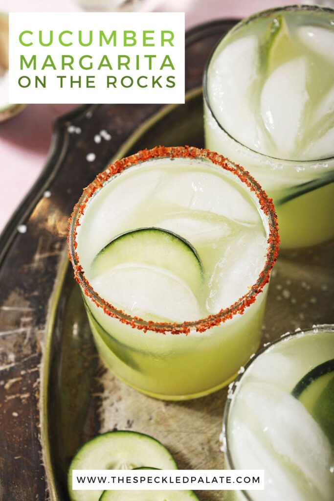 Three margaritas on a silver tray with the text cucumber margarita on the rocks