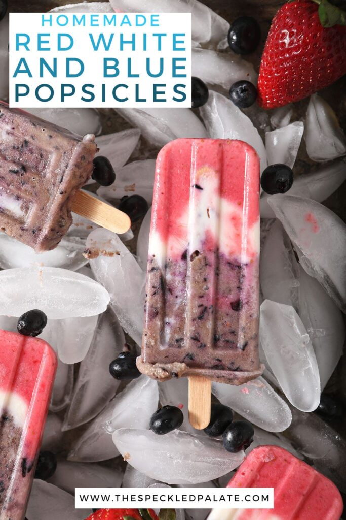 Multiple Greek yogurt fruit popsicles on ice with the text homemade red white and blue popsicles