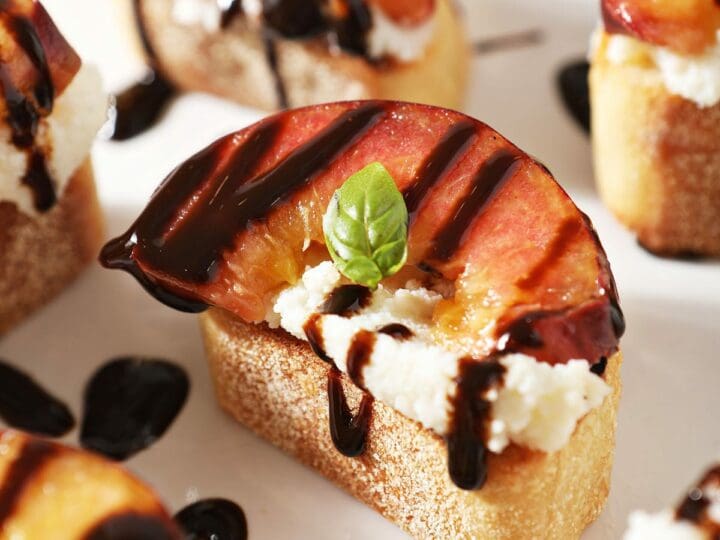 Close up of a Ricotta Crostini with a Grilled Peach