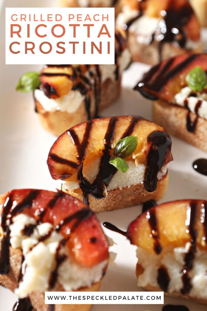 Several peach crostini on a white tray with the text grilled peach ricotta crostini