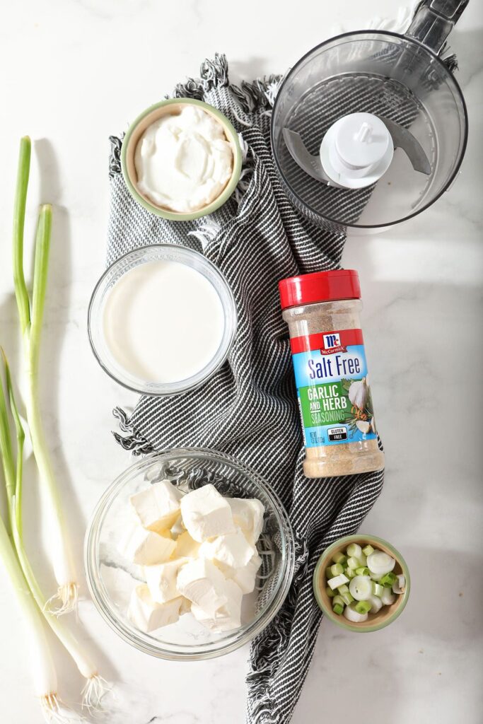 Ingredients for an easy dip recipe in bowls on marble