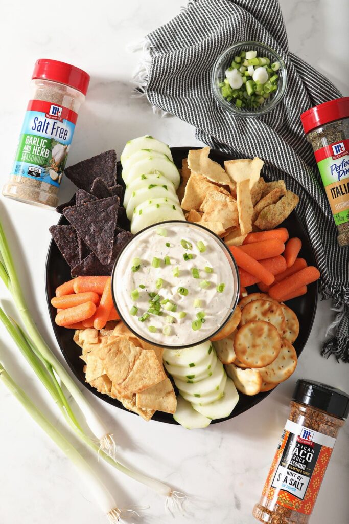 A platter of dippers with an easy dip recipe on marble