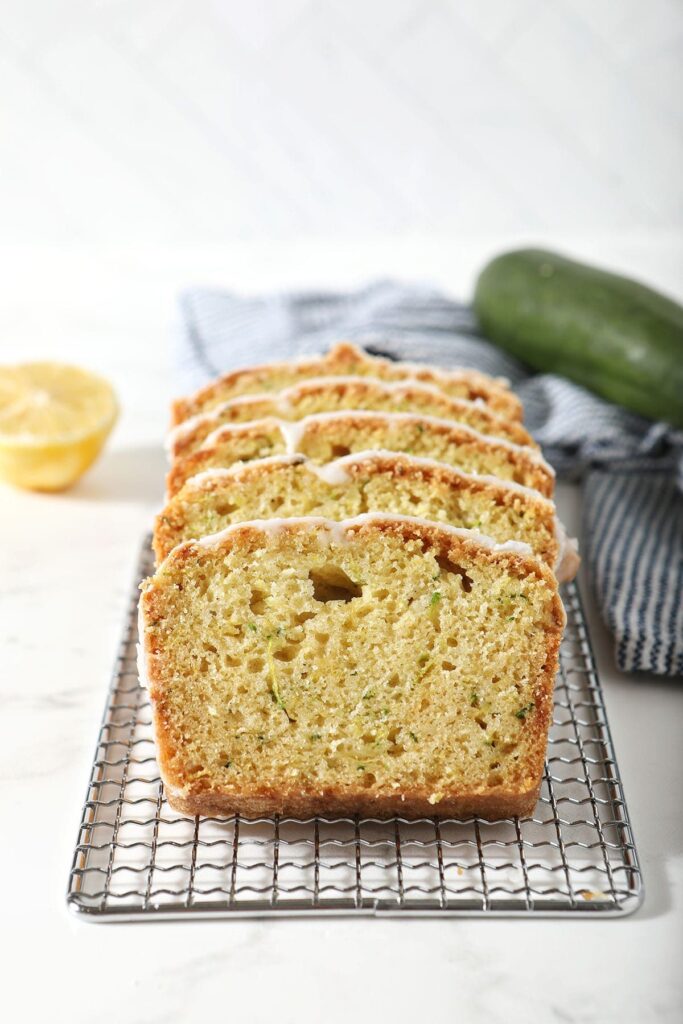 Slices of lemon zucchini bread on a wire rack