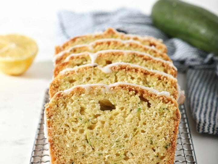 Slices of lemon zucchini bread on a wire rack