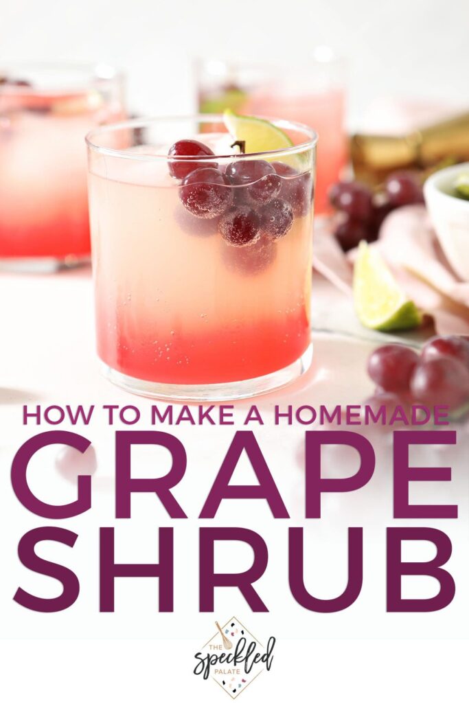 A drink garnished with a lime wedge and grapes with the text how to make a homemade grape shrub