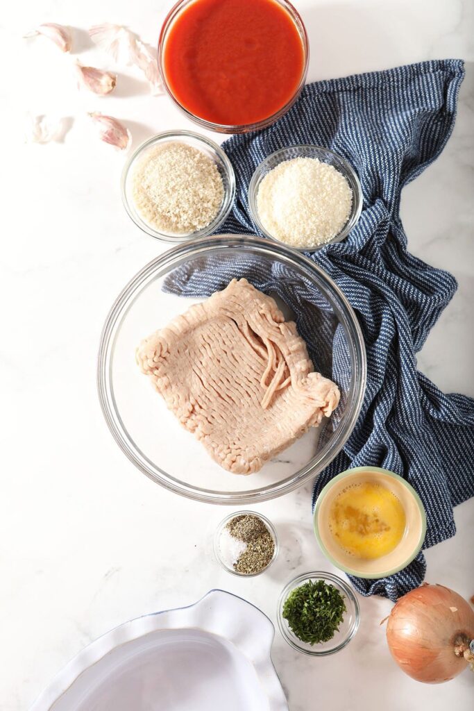 Ground chicken and other ingredients in bowls