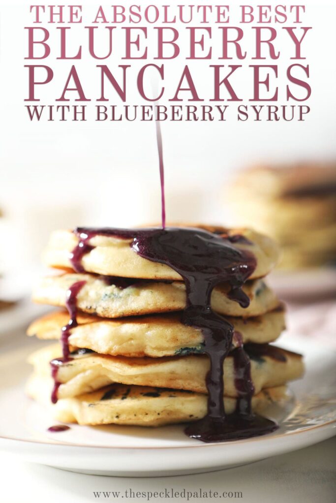 Syrup pours onto a stack of pancakes with the text the absolute best blueberry pancakes with blueberry syrup