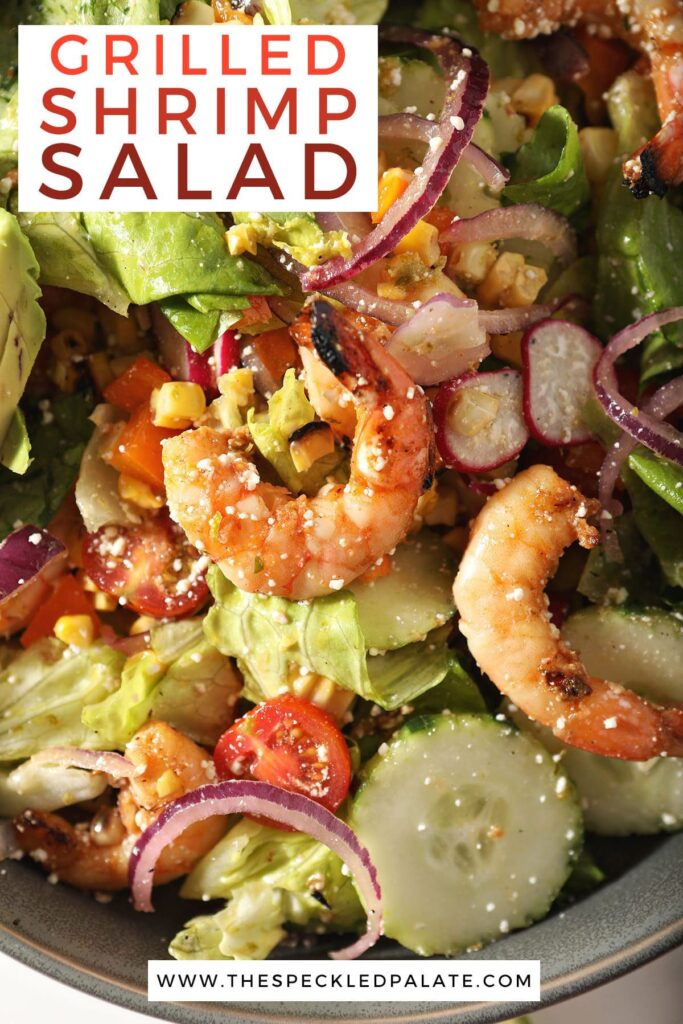 Close up of shrimp on a salad with the text grilled shrimp salad