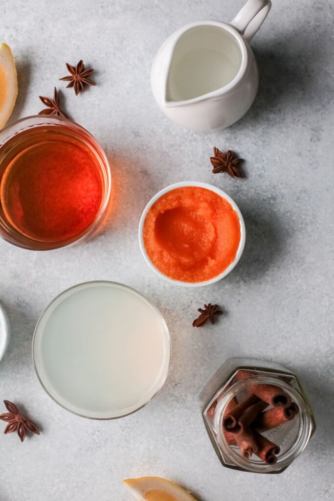 Ingredients for a pumpkin spice cocktail in bowls