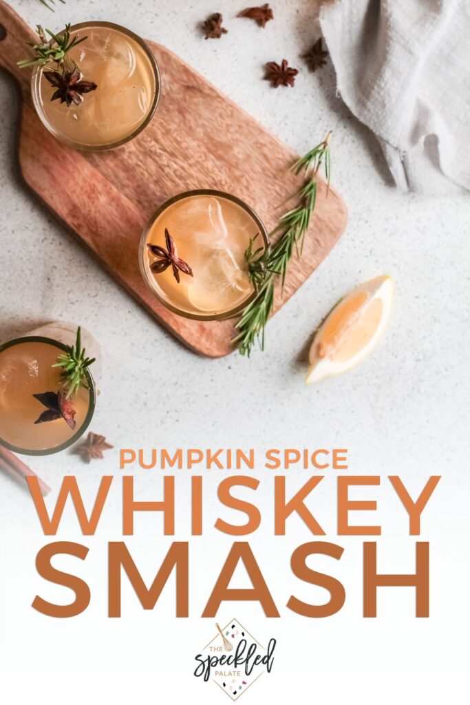 Three glasses of orange liquid from above with rosemary and star anise with text pumpkin spice whiskey smash