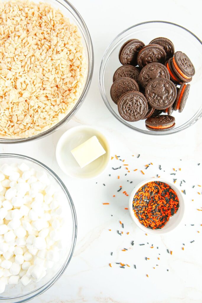 Ingredients for Halloween rice krispie treats in bowls