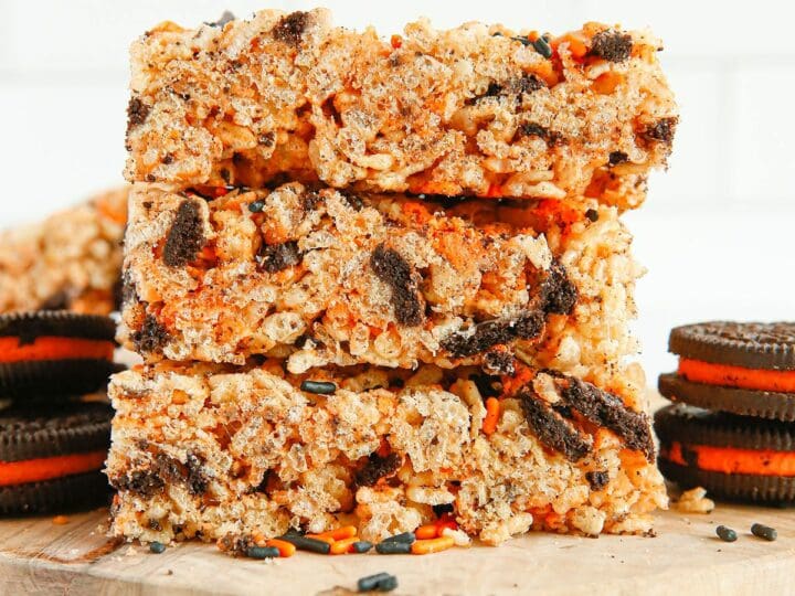 A stack of Halloween Oreo Rice Krispie Treats on wood