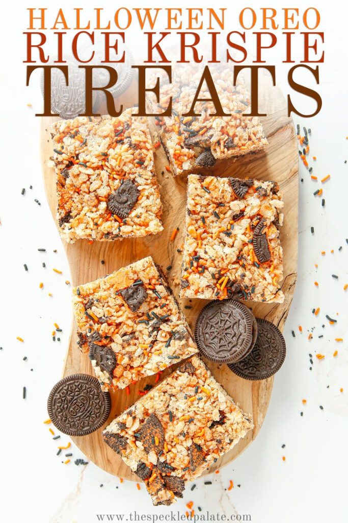 Krispie treats with oreos on a wooden board with the text Halloween Oreo Rice Krispie Treats