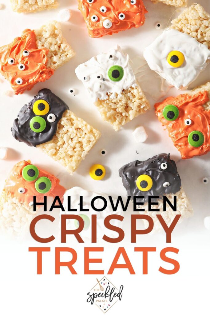 Orange, white and black monster rice krispie treats with the text Halloween Crispy Treats