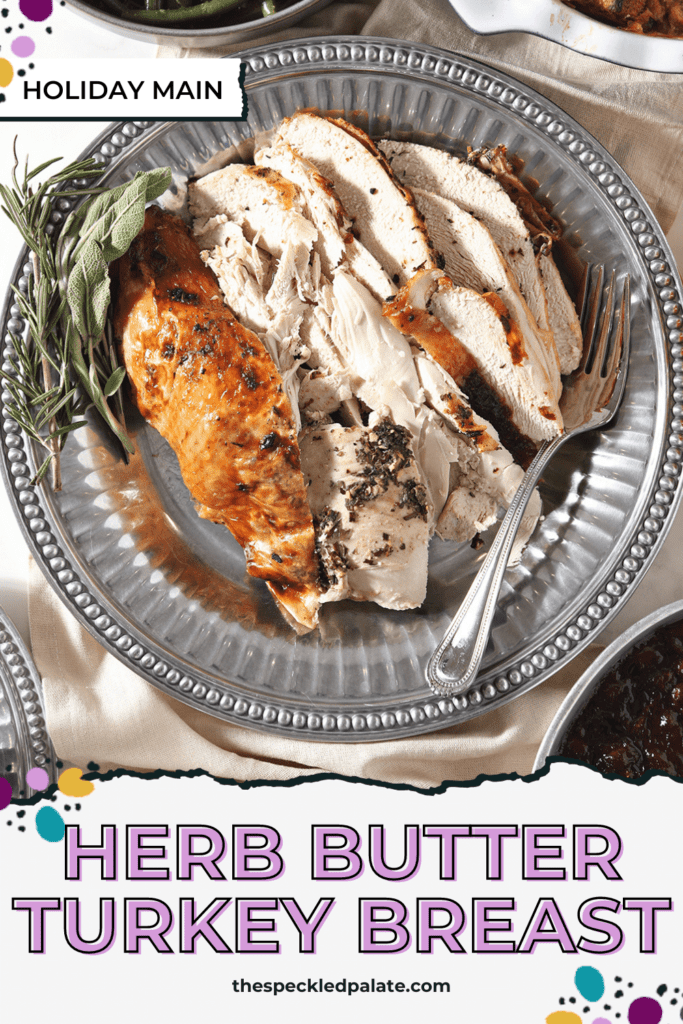 A silver platter of sliced turkey breast and skin with herbs with the text herb butter turkey breast