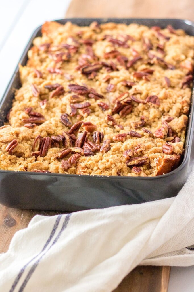 A dark gray pan of Pumpkin French Toast Casserole after baking