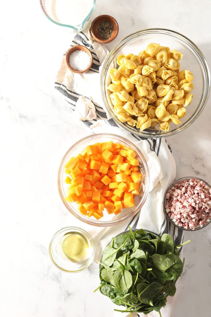 Butternut squash, pasta and other ingredients in bowls