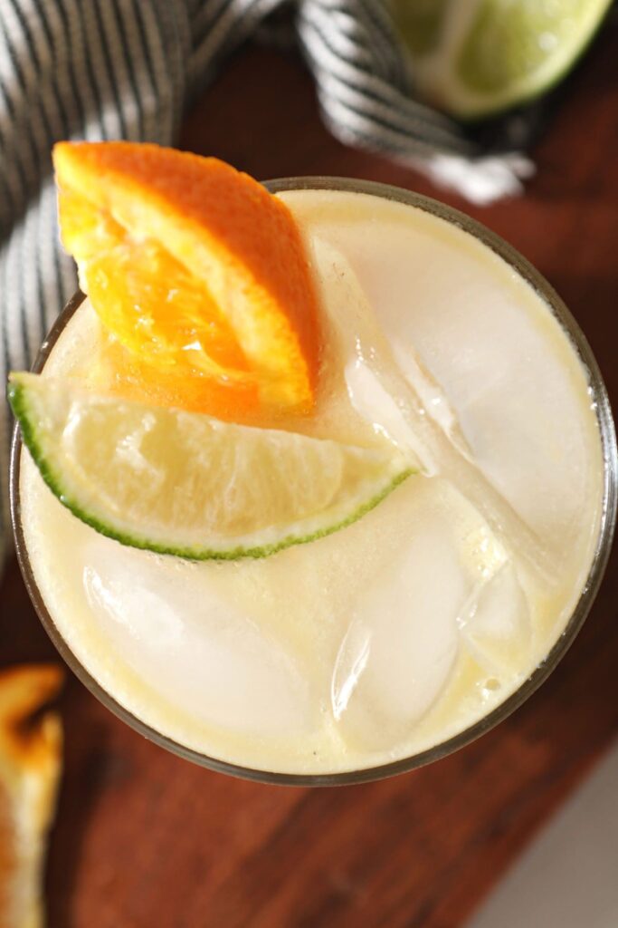 Close up of a Virgin Margarita with an orange and lime wedge