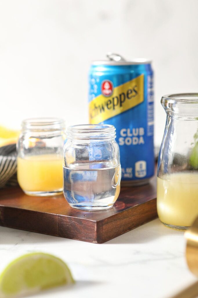 Ingredients to make a margarita mocktail on wood