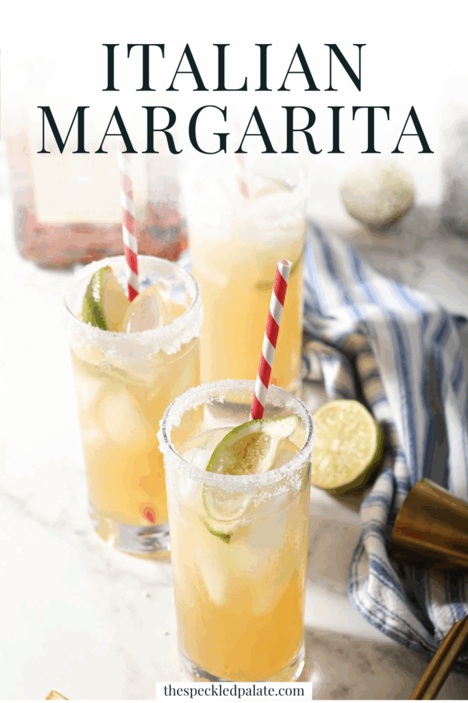 Three tall golden drinks garnished with limes and red striped straws with the text italian margarita