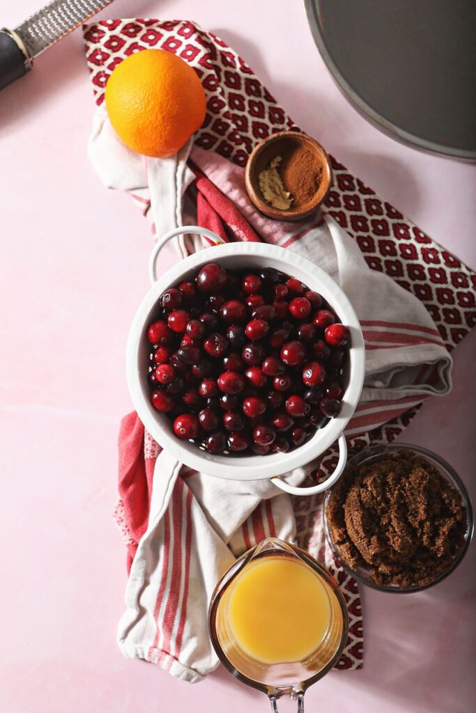 Cranberries and other ingredients in bowls on towels