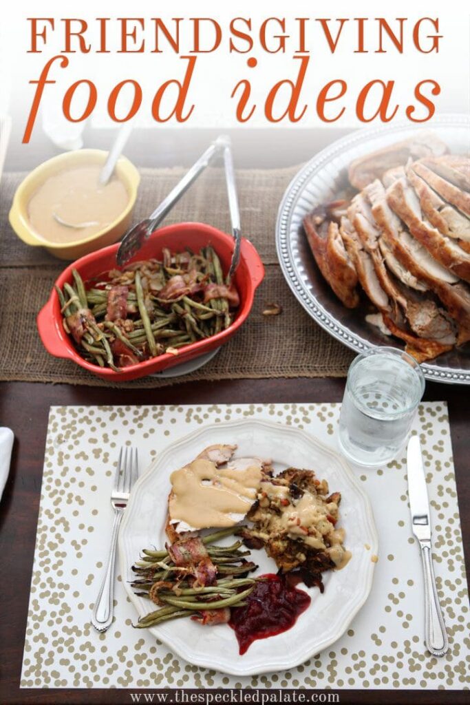 A plate of Thanksgiving food on a table with the text friendsgiving food ideas