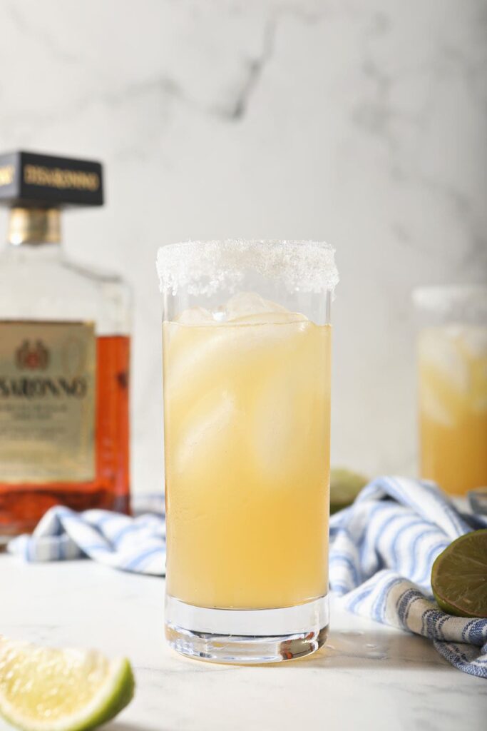 A golden Italian margarita with a sugar rim on marble