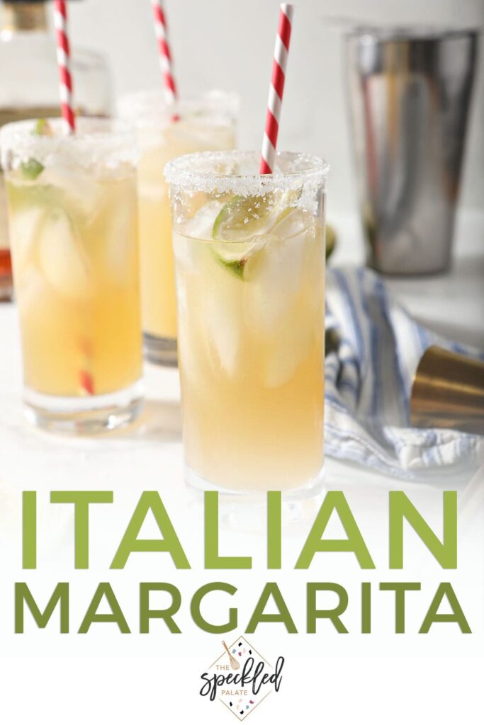 Three tall golden drinks garnished with limes and red striped straws with the text italian margarita