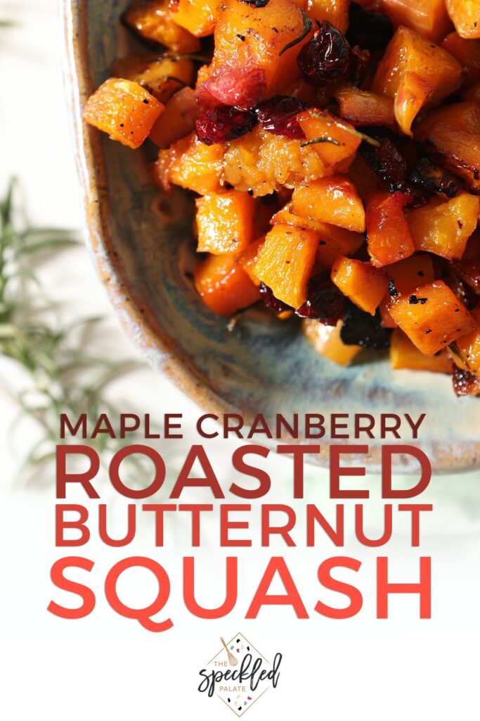 A blue platter of cranberry butternut squash with the text maple cranberry roasted butternut squash