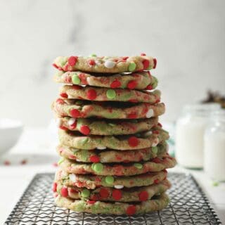 A stack of Christmas Confetti Cookies on a wire rack