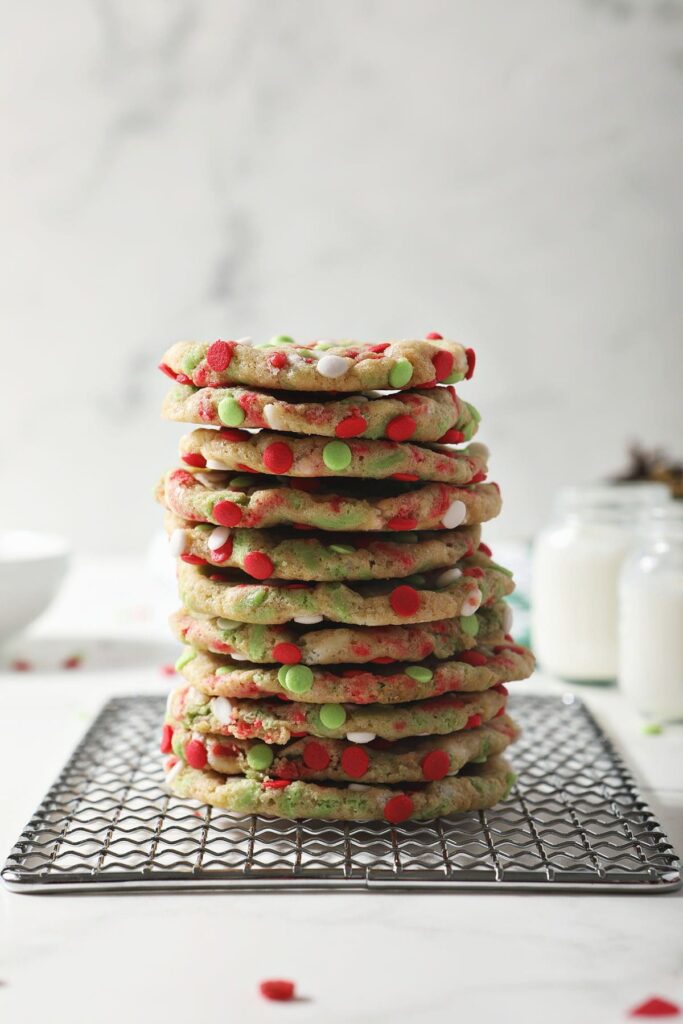 A stack of Christmas Confetti Cookies on a wire rack