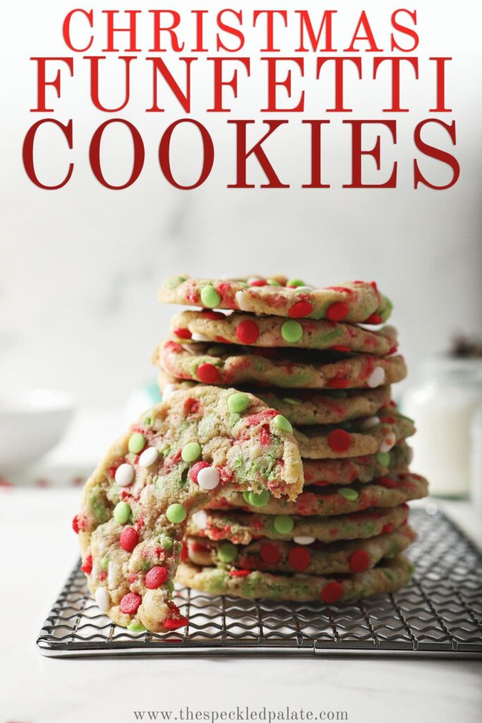 A stack of sprinkle cookies on a wire rack with the text christmas funfetti cookies