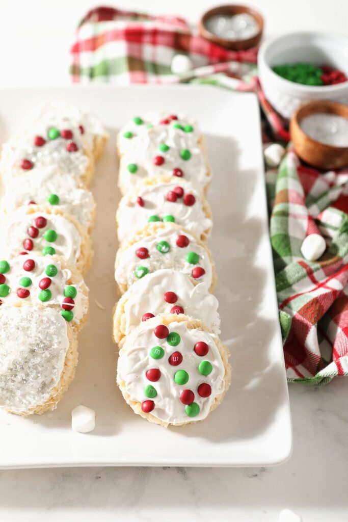 A platter of decorated Rice Krispie Treat ornaments for Christmas