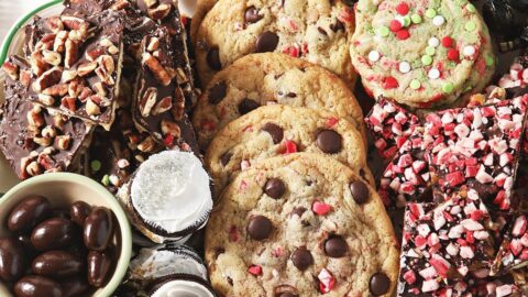 A platter holds colorful Christmas cookies