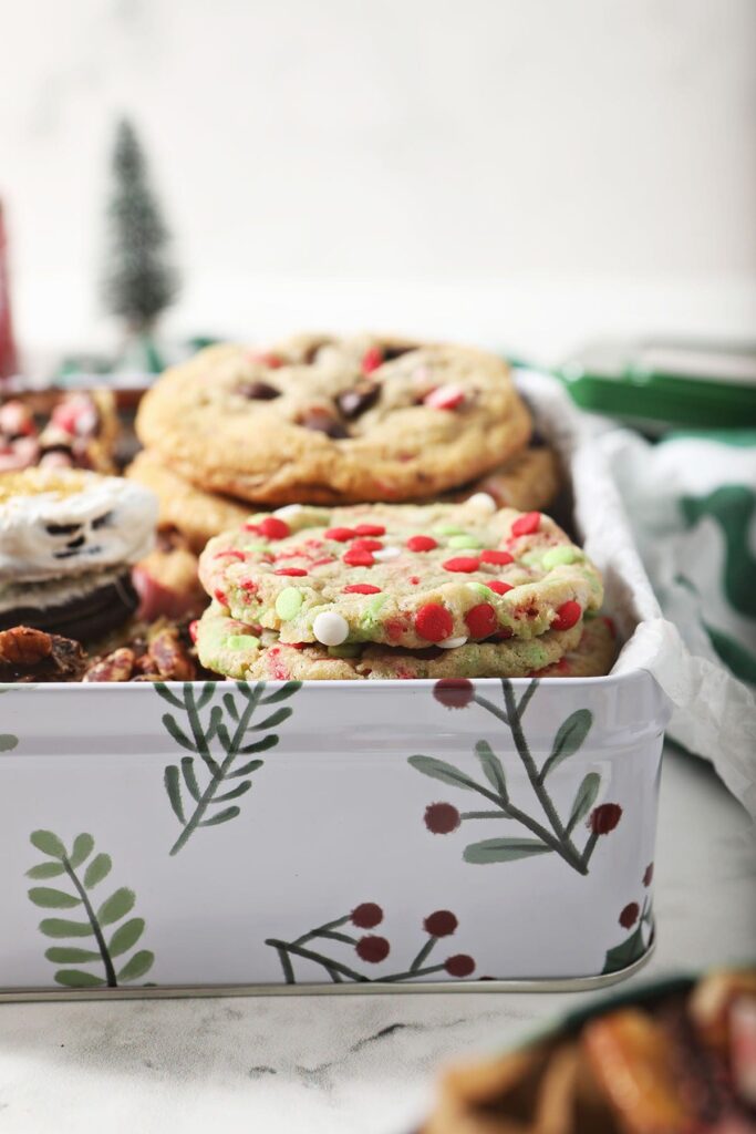 Cookies stacked in a Christmas cookie tin