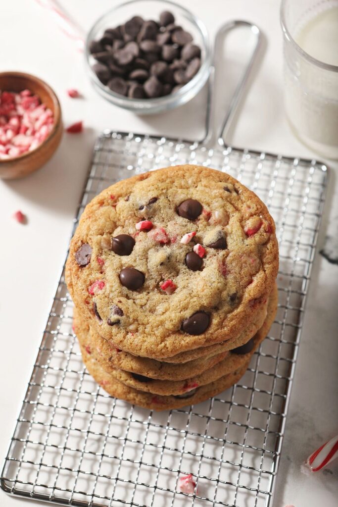 A stack of Peppermint Chocolate Chip Cookies on a wire cooling rack