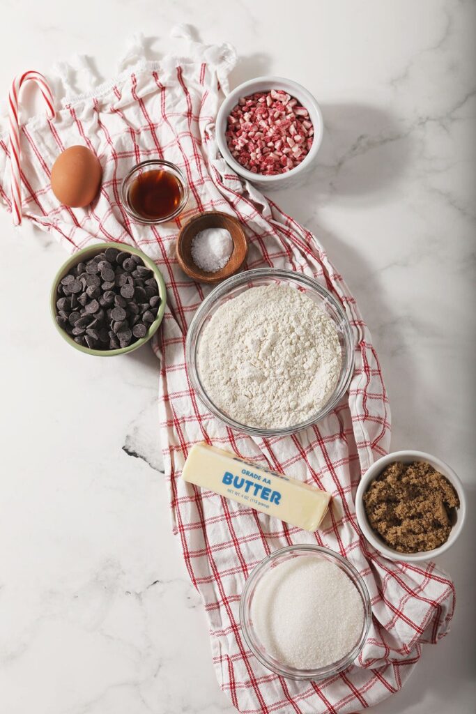 Cookie ingredients in bowls on a red plaid towel