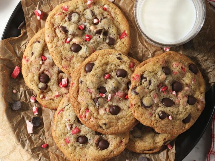 A plate of Peppermint Chocolate Chip Cookies with a glass of milk
