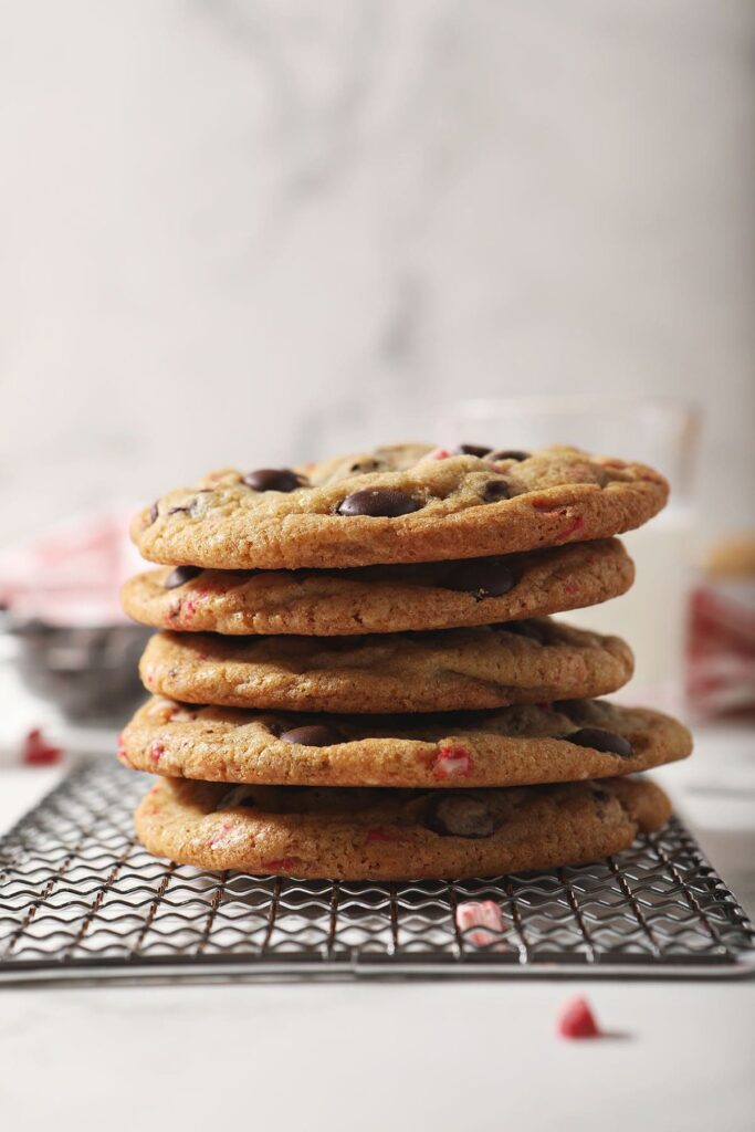 A stack of Peppermint Chocolate Chip Cookies on a wire rack