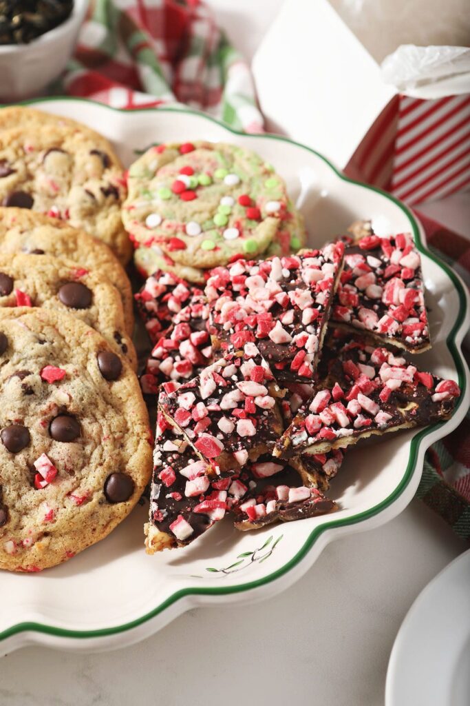 A Christmas cookie tray holding peppermint saltine cracker toffee and cookies