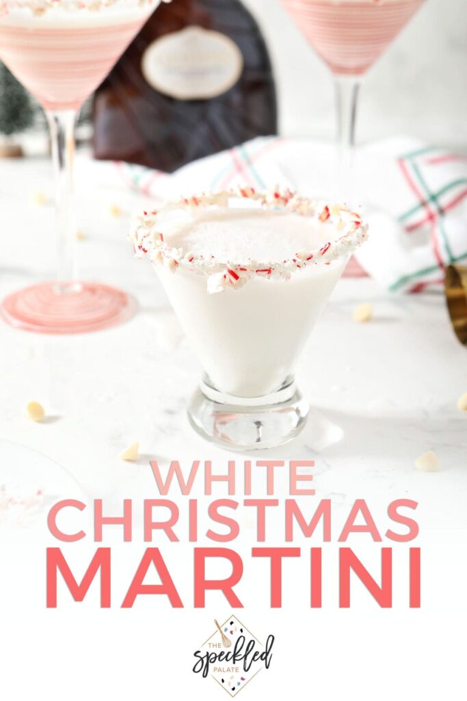 A martini glass of white liquid with the text white christmas martini