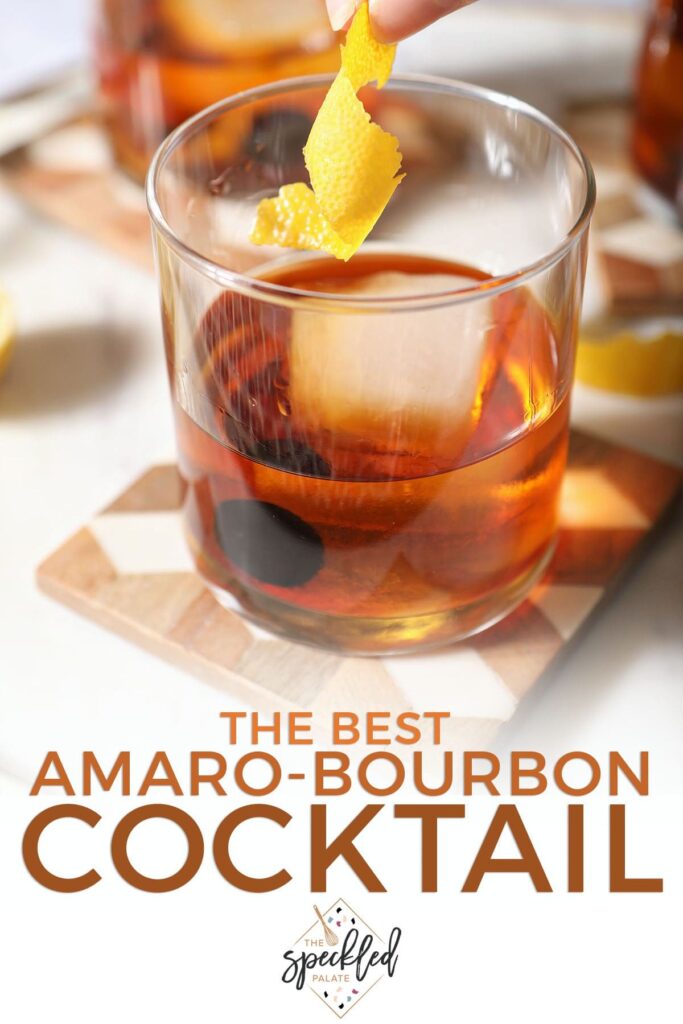 A lemon twist drops into a golden drink with the text the best amaro-bourbon cocktail