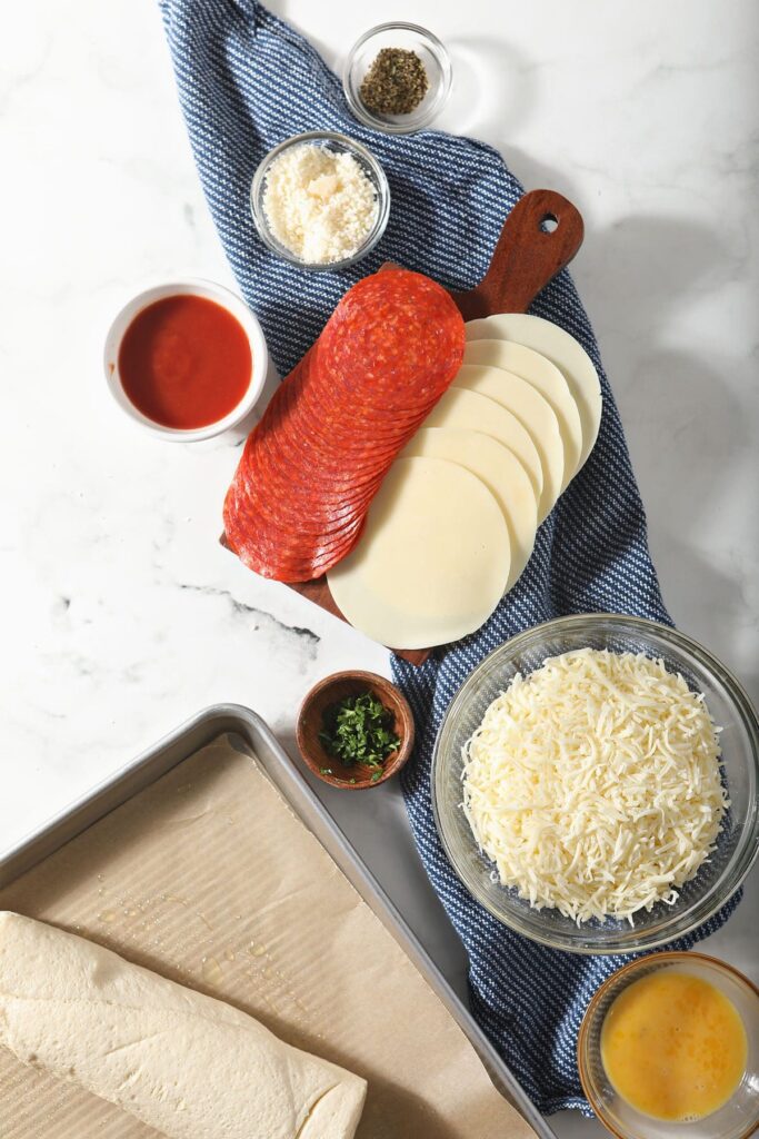 Ingredients for homemade stromboli on marble