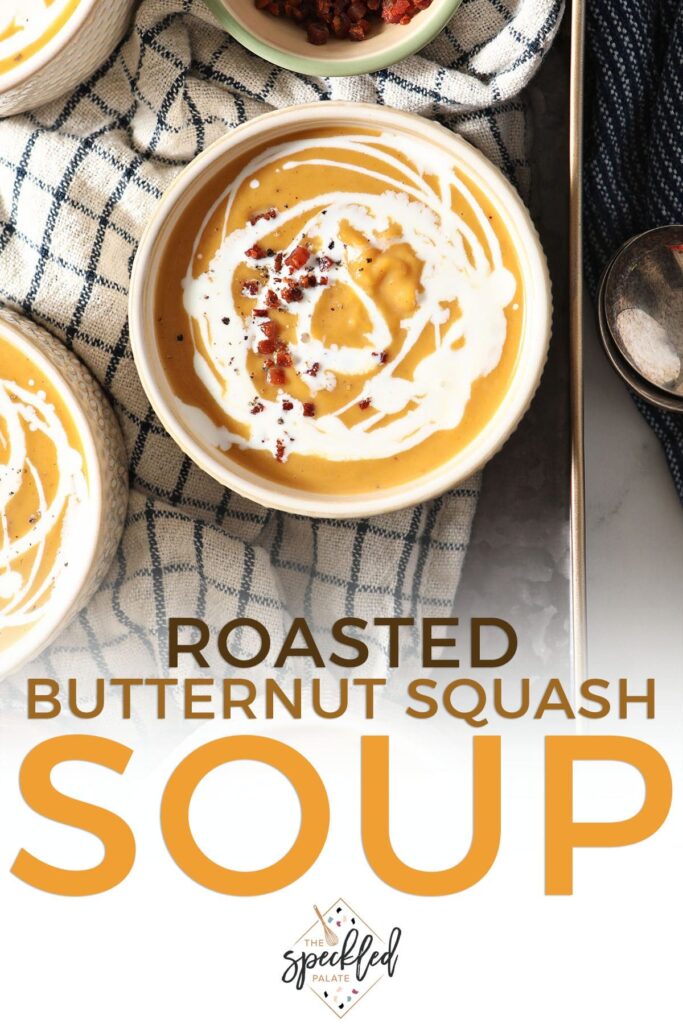 Four bowls of orange on a blue striped towel with the text Roasted Butternut Squash Soup