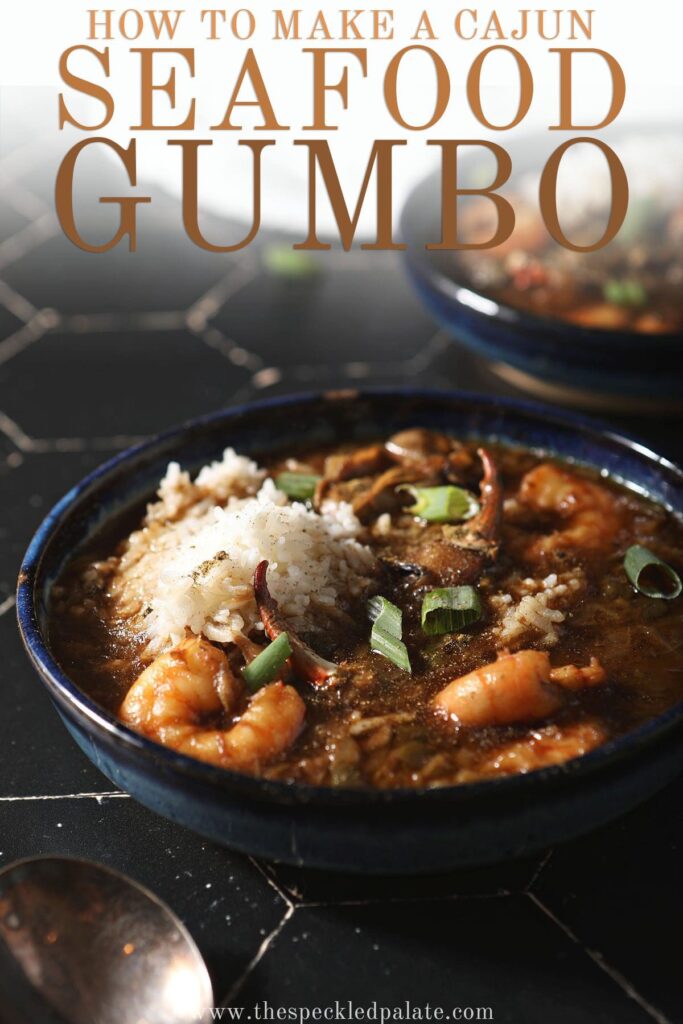 A bowl of seafood gumbo on black tile with rice with the text how to make a cajun seafood gumbo