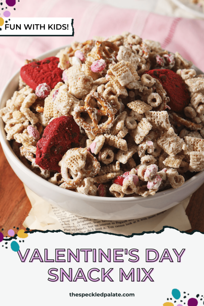 A bowl of Valentine's Day white chocolate chex mix with the text valentine's day snack mix