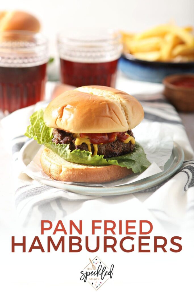 A burger on a plate with the text pan fried hamburgers